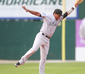 Ramon Morla lunges for a ball hit during Sunday night's game in Mobile. 